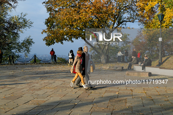 People are on the observation deck on Starokyivska (Old Kyiv) Hill in Kyiv, Ukraine, on October 28, 2024. NO USE RUSSIA. NO USE BELARUS. 