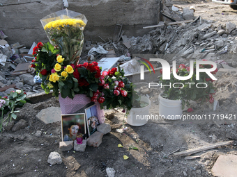 Flowers lie in memory of those killed by the Russian missile attack in the Novokodatskyi district in the evening on Friday, October 25, in D...