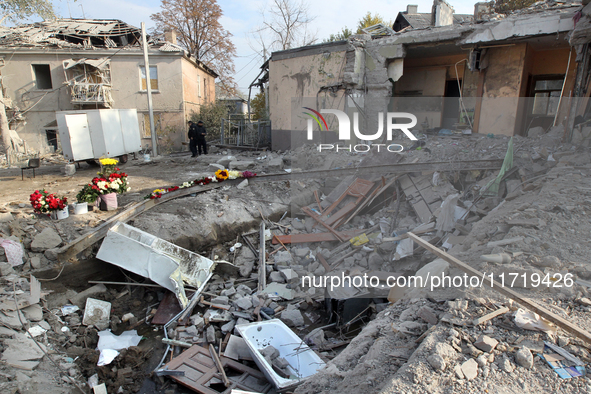 Flowers lie in memory of those killed by the Russian missile attack in the Novokodatskyi district in the evening on Friday, October 25, in D...