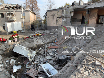 Flowers lie in memory of those killed by the Russian missile attack in the Novokodatskyi district in the evening on Friday, October 25, in D...