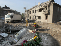 Flowers lie in memory of those killed by the Russian missile attack in the Novokodatskyi district in the evening on Friday, October 25, in D...