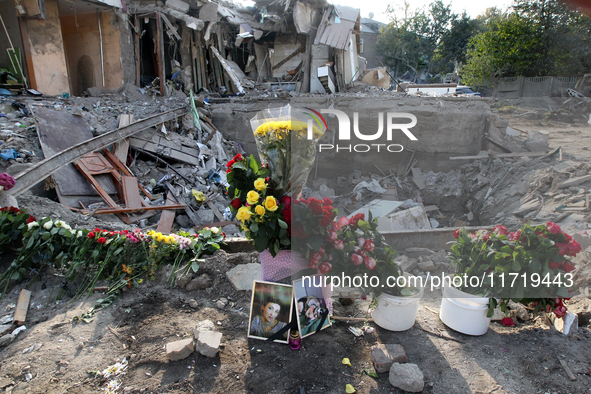 Flowers lie in memory of those killed by the Russian missile attack in the Novokodatskyi district in the evening on Friday, October 25, in D...