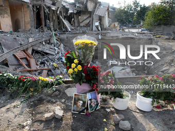 Flowers lie in memory of those killed by the Russian missile attack in the Novokodatskyi district in the evening on Friday, October 25, in D...