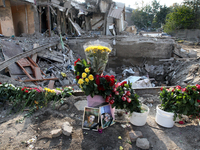 Flowers lie in memory of those killed by the Russian missile attack in the Novokodatskyi district in the evening on Friday, October 25, in D...