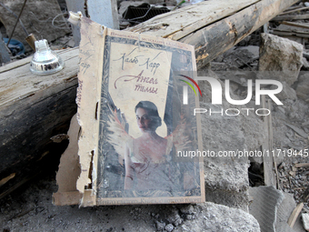 A book cover is among the debris on the ground after the Russian missile attack in the Novokodatskyi district in Dnipro, Ukraine, on October...