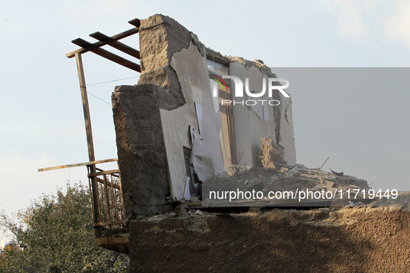 A section of a wall of a residential building remains standing after the Russian missile attack in the Novokodatskyi district in Dnipro, Ukr...