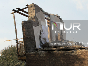 A section of a wall of a residential building remains standing after the Russian missile attack in the Novokodatskyi district in Dnipro, Ukr...