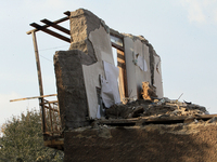 A section of a wall of a residential building remains standing after the Russian missile attack in the Novokodatskyi district in Dnipro, Ukr...