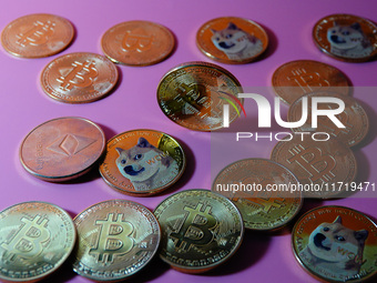 A physical commemorative coin of Bitcoin, Dogecoin, and Ethereum is displayed in Yichang, Hubei province, China, on October 29, 2024. (