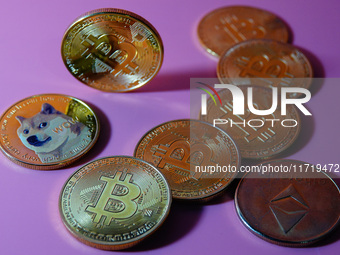 A physical commemorative coin of Bitcoin, Dogecoin, and Ethereum is displayed in Yichang, Hubei province, China, on October 29, 2024. (