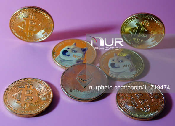 A physical commemorative coin of Bitcoin, Dogecoin, and Ethereum is displayed in Yichang, Hubei province, China, on October 29, 2024. 