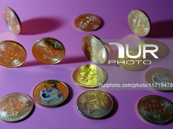 A physical commemorative coin of Bitcoin, Dogecoin, and Ethereum is displayed in Yichang, Hubei province, China, on October 29, 2024. (