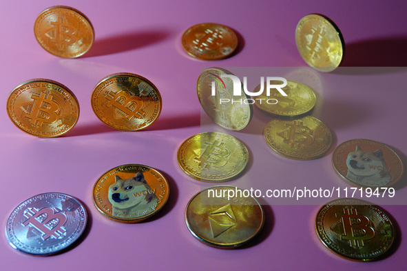 A physical commemorative coin of Bitcoin, Dogecoin, and Ethereum is displayed in Yichang, Hubei province, China, on October 29, 2024. 