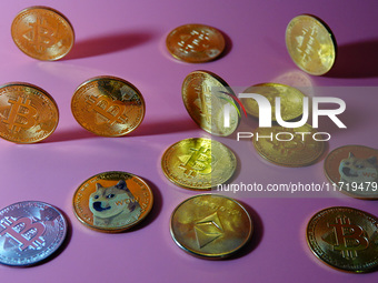 A physical commemorative coin of Bitcoin, Dogecoin, and Ethereum is displayed in Yichang, Hubei province, China, on October 29, 2024. (