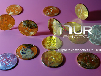 A physical commemorative coin of Bitcoin, Dogecoin, and Ethereum is displayed in Yichang, Hubei province, China, on October 29, 2024. (