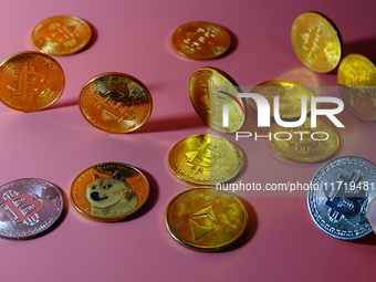 A physical commemorative coin of Bitcoin, Dogecoin, and Ethereum is displayed in Yichang, Hubei province, China, on October 29, 2024. (