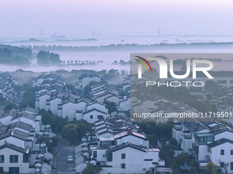 The landscape of advection fog appears in Wafang Village on the banks of the ancient Bian River in Suqian, China, on October 29, 2024. (