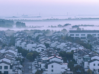 The landscape of advection fog appears in Wafang Village on the banks of the ancient Bian River in Suqian, China, on October 29, 2024. (