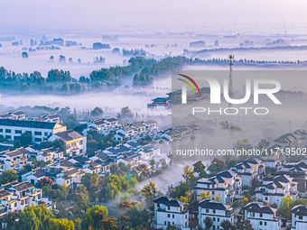 The landscape of advection fog appears in Wafang Village on the banks of the ancient Bian River in Suqian, China, on October 29, 2024. (