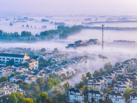 The landscape of advection fog appears in Wafang Village on the banks of the ancient Bian River in Suqian, China, on October 29, 2024. (