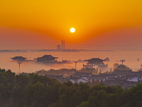 The landscape of advection fog appears in Wafang Village on the banks of the ancient Bian River in Suqian, China, on October 29, 2024. (