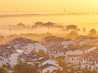 The landscape of advection fog appears in Wafang Village on the banks of the ancient Bian River in Suqian, China, on October 29, 2024. (