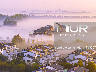 The landscape of advection fog appears in Wafang Village on the banks of the ancient Bian River in Suqian, China, on October 29, 2024. (