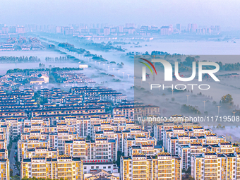 The landscape of advection fog appears in Wafang Village on the banks of the ancient Bian River in Suqian, China, on October 29, 2024. (