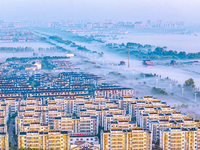 The landscape of advection fog appears in Wafang Village on the banks of the ancient Bian River in Suqian, China, on October 29, 2024. (