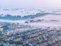 The landscape of advection fog appears in Wafang Village on the banks of the ancient Bian River in Suqian, China, on October 29, 2024. (