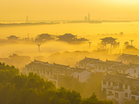 The landscape of advection fog appears in Wafang Village on the banks of the ancient Bian River in Suqian, China, on October 29, 2024. (