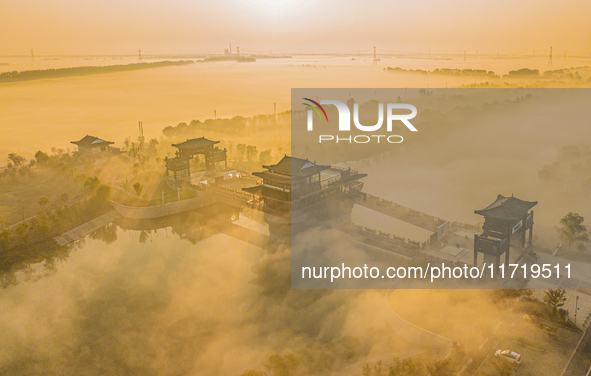 The landscape of advection fog appears in Wafang Village on the banks of the ancient Bian River in Suqian, China, on October 29, 2024. 