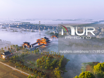 The landscape of advection fog appears in Wafang Village on the banks of the ancient Bian River in Suqian, China, on October 29, 2024. (