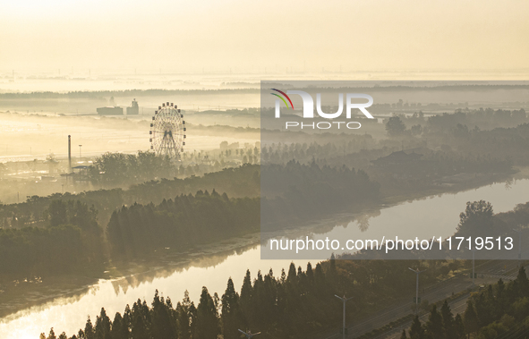 The landscape of advection fog appears in Wafang Village on the banks of the ancient Bian River in Suqian, China, on October 29, 2024. 