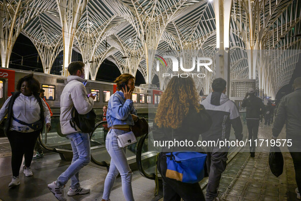 People gather on one of the platforms at Oriente railway station in Lisbon, Portugal, on October 28, 2024. Due to a growing shortfall in ben...