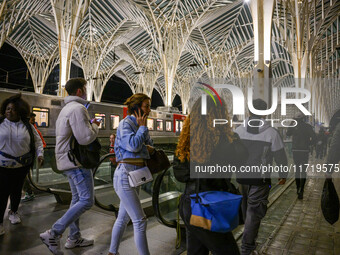 People gather on one of the platforms at Oriente railway station in Lisbon, Portugal, on October 28, 2024. Due to a growing shortfall in ben...