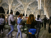 People gather on one of the platforms at Oriente railway station in Lisbon, Portugal, on October 28, 2024. Due to a growing shortfall in ben...