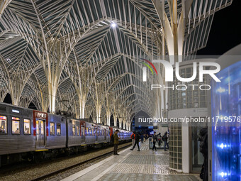 People gather on one of the platforms at Oriente railway station in Lisbon, Portugal, on October 28, 2024. Due to a growing shortfall in ben...