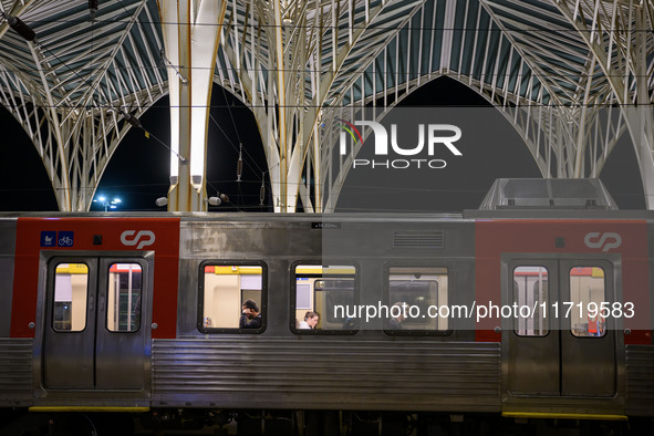 Several passengers are inside a train carriage at Oriente railway station in Lisbon, Portugal, on October 28, 2024. Due to a growing shortfa...