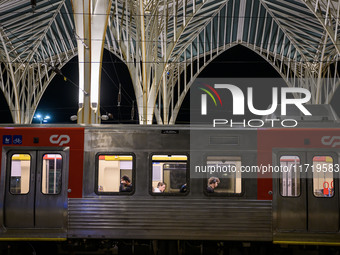 Several passengers are inside a train carriage at Oriente railway station in Lisbon, Portugal, on October 28, 2024. Due to a growing shortfa...