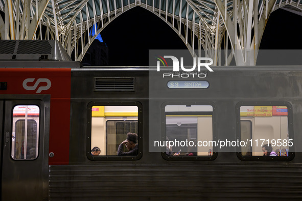 Several passengers are inside a train carriage at Oriente railway station in Lisbon, Portugal, on October 28, 2024. Due to a growing shortfa...