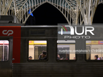 Several passengers are inside a train carriage at Oriente railway station in Lisbon, Portugal, on October 28, 2024. Due to a growing shortfa...