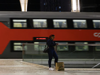 A person stands waiting for the arrival of a train on a platform at Oriente railway station in Lisbon, Portugal, on October 28, 2024. Due to...