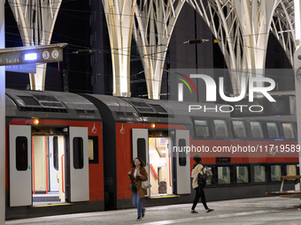 Several people get off a train on a platform at Oriente railway station in Lisbon, Portugal, on October 28, 2024. Due to a growing shortfall...