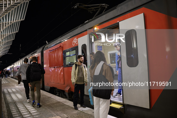 People board a train on one of the platforms at Oriente railway station in Lisbon, Portugal, on October 28, 2024. Due to a growing shortfall...