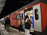 People board a train on one of the platforms at Oriente railway station in Lisbon, Portugal, on October 28, 2024. Due to a growing shortfall...