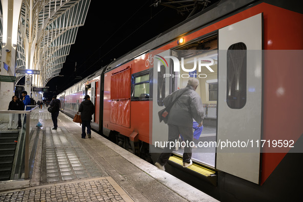 People board a train on one of the platforms at Oriente railway station in Lisbon, Portugal, on October 28, 2024. Due to a growing shortfall...