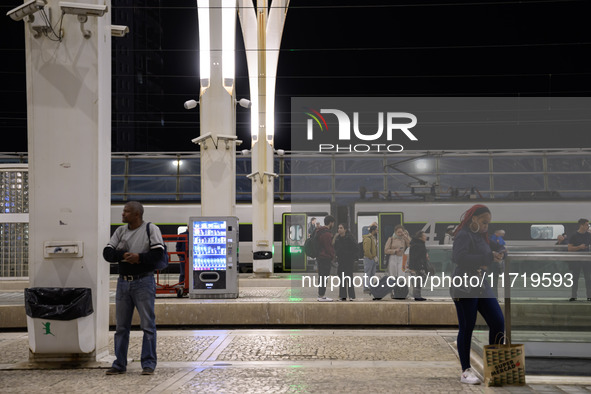 People gather on one of the platforms at Oriente railway station in Lisbon, Portugal, on October 28, 2024. Due to a growing shortfall in ben...