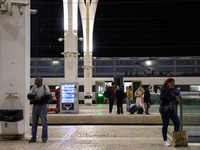 People gather on one of the platforms at Oriente railway station in Lisbon, Portugal, on October 28, 2024. Due to a growing shortfall in ben...