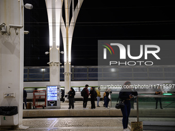 People gather on one of the platforms at Oriente train station in Lisbon, Portugal, on October 28, 2024. Due to a growing shortfall in benef...